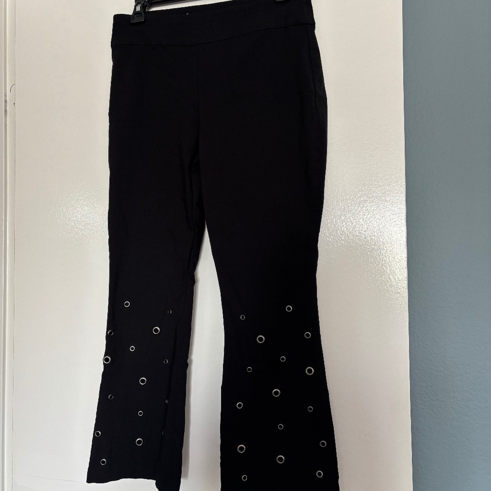 Wmn size 8, INC, pull on, stretch, black FLARE pants w/GROMMETs by front hem.